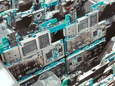 Rows of electronic circuit boards in a production tray.